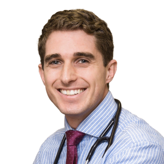 John Brennan in a striped shirt and maroon tie with stethoscope, representing a healthcare professional.